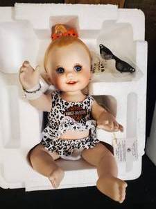 lot 45 image: New in Box Harley Davidson Ceramic Baby  Includes Sunglasses and Bracelet