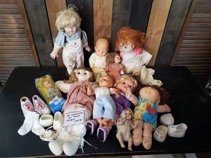 lot 67 image: Doll Lot includes a Cabbage Patch Doll, Shoes, and More