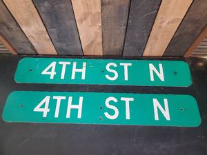 lot 112 image: 2 4th St. North Retired Signs Think Bob Dylan