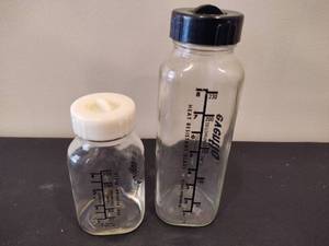 lot 86 image: Glass Evenflo Baby Bottles