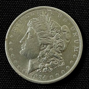 lot 24 image: 1884-O Morgan Silver Dollar AU-EF