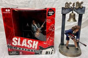 lot 79 image: McFarlane Toys Guns N Roses Slash 2005 Figure and ACDC Guitarist Angus Young 2001 Figure