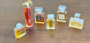 lot 70 image: Miniature Givenchy, Chanel and Yves Saint Laurent Perfume Bottles