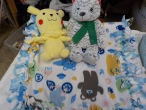 lot 24 image: Baby Blanket and Stuffed Animals...
