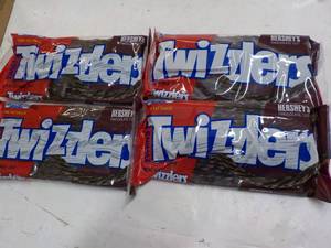 lot 297 image: 4 ct 12 oz bags Twizzlers Hersheys...