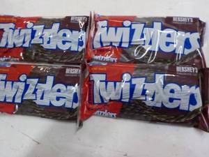 lot 298 image: 4 ct 12 oz bags Twizzlers Hersheys...