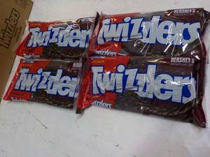 lot 302 image: 4 ct 12 oz bags Twizzlers Hersheys...