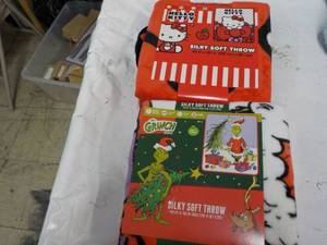 lot 16 image: Hello Kitty and Grinch Throws...