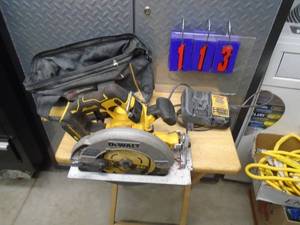 Dewalt 20 volt saw with charger & bag. No battery. Unable to fully test. As shown.