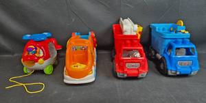 lot 44 image: Collection of 4 Pull-Along Toy Vehicles and 5 Stuffed Animals