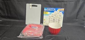 lot 62 image: Brita Water Filter Set, Red Bowl, Clear Cutting Board, and Red Party Plates