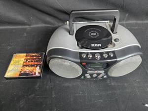 lot 197 image: RCA Boombox with Twin Bass and Garrison Keillor 5-CD Collection