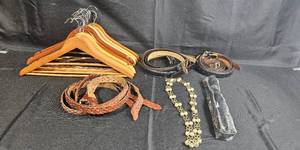 lot 106 image: Collection of Wooden Hangers, Leather Belts, and Beaded Necklace