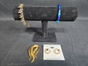 lot 58 image: Assorted Jewelry Set Liz Claiborne Earrings, Leaf Bracelet, Blue Bead Bracelet, and Goldtone Brooch