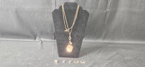 lot 40 image: Premier Designs Rose Gold Tone Necklace with Charms and Stackable Rings Set