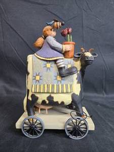 lot 109 image: Williraye Studio Spring Delivery Cow on Wheels Figurine
