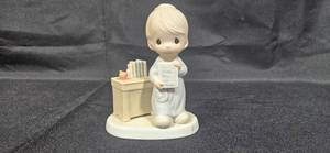 lot 233 image: 1984 Precious Moments Love Never Fails Figurine by Samuel J. Butcher