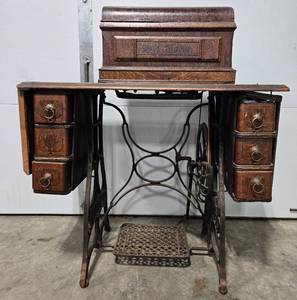 lot 438 image: Antique Treadle Sewing Machine with Wooden Cabinet - untested