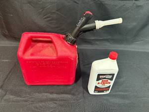 lot 388 image: 2 Gallon Press N Pour Gas Can and Pro-Select Bar & Chain Oil