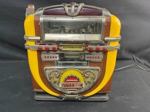 lot 479 image: Vintage Tabletop Jukebox CD Player with Wood and Yellow Accents