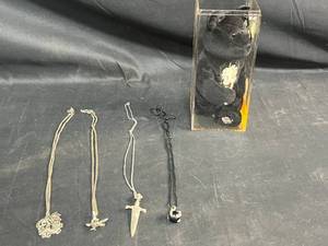 lot 481 image: Collection of 4 Fantasy-Themed Necklaces and a Plush Bear