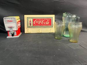 lot 484 image: Coca-Cola Collectible Set with Dispenser, Sign, Pitcher, and Glasses