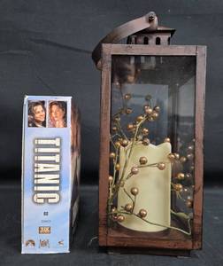 lot 501 image: Decorative Lantern with LED Candle and Titanic VHS