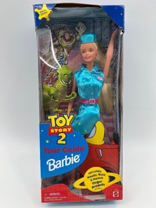 lot 39 image: Toy Story 2 Tour Guide Barbie Doll with Woody, Buzz, and Rex Figures