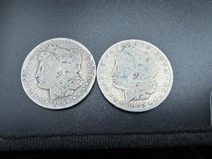 Two Bullion Grade Morgan Dollars, 1899 O, 1900 O