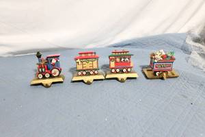 lot 100 image: Set of 4 Christmas Train Stocking Holders