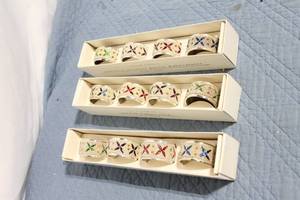 lot 101 image: Set of 12 Jeweled Napkin Rings in Original Packaging