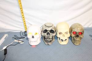 lot 146 image: Set of 4 Light-Up Halloween Skull Decorations