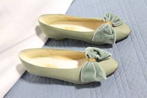 lot 158 image: Pair of Green Slip-On Bow Flats by Dyables