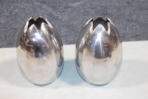 lot 222 image: Pair of Polished Metal Egg-Shaped Vases with Unique Open Top Design