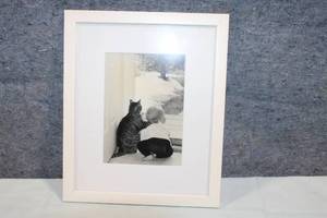 lot 230 image: Framed Black and White Photograph of Child and Cat at Window