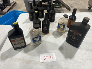 TABLE FULL OF HD FORK OIL, BRAKE FLUID DOT 4 & 5, & 10W40 MOTOR OIL