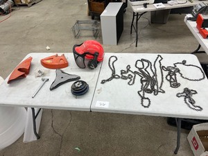 TABLE FULL OF CHAINSAW CHAINS & WEED EATER ACCESSORIES & HELMET