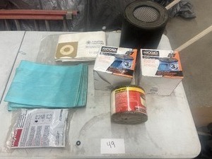 TABLE FULL OF VACUUM BAGS & FILTERS