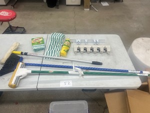 TABLE FULL OF CLEANING ITEMS