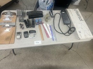 TABLE FULL OF OFFICE ITEMS
