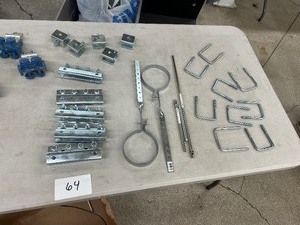 TABLE FULL OF HANGLINE COMPONENTS