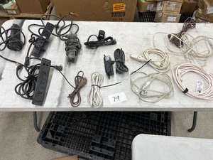 TABLE FULL OF CABINET POWER PLUGINS & EXTENTION CORDS