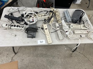 TABLE FULL OF POWER STRIPS