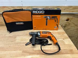 lot 124 image: RIDGID R71111 8 Amp Corded 12 in. Heavy-Duty Variable Speed Reversible Drill with Bag - B139