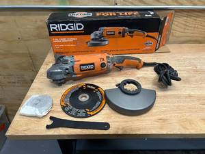 lot 125 image: RIDGID R10202 15 Amp Corded 7 in. Twist Handle Angle Grinder - D129
