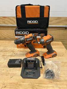 lot 130 image: RIDGID R97801 18V SubCompact Brushless 2-Tool Combo Kit with DrillDriver, Impact Driver, Charger, and Tool Bag -D199