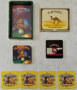lot 39 image: More Vintage Camel  (1) Camel Lights - Joe Playing Pool - Ashtray (1) Camel- Joe Playing Pool - Tin (1) Camel Izmir Stinger - Black - Tin (1) Camel Cigarettes Box (Cardboard) (4) Camel Smooth Character Coasters - Yellow