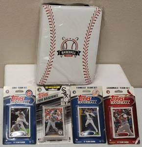 lot 49 image: (1) Baseball League Card Binder with Sleeves & (1 Box) Chicago Cubs topps 2012 Card Set (1 Box) Chicago White Sox topps 2011 Card Set (1 Box) New York Yankees topps 2012 Card Set (1 Box) St Louis Cardinals topps 2012 Card Set