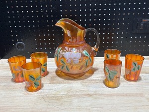 lot 5 image: Vintage Carnival Glass Orange Pitcher and Glasses
