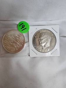 lot 191 image: Prospector 1oz Round and 1974 Ike AU